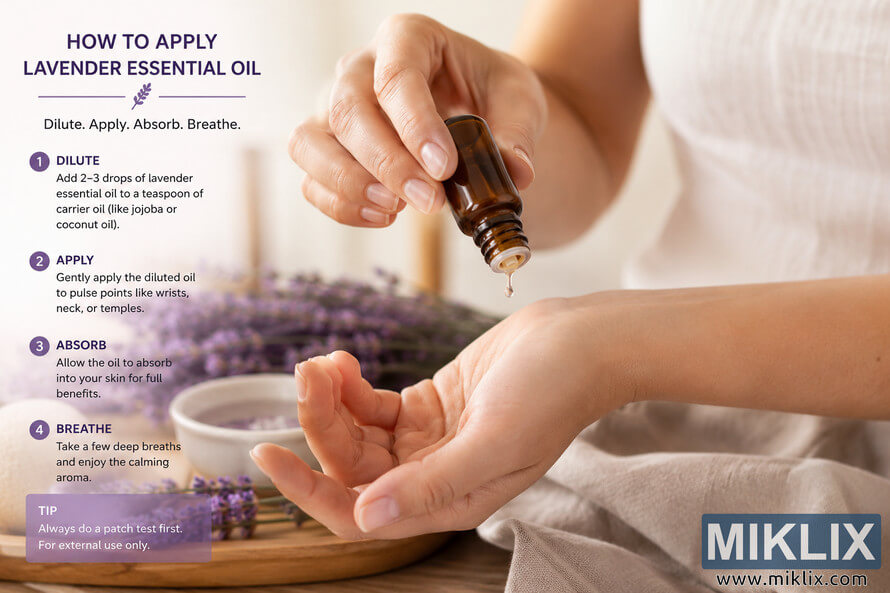 Close-up landscape image of hands carefully applying diluted lavender essential oil from a small amber glass bottle onto the wrist in a calm spa-inspired setting with soft lavender flowers and neutral fabrics in the background. The scene includes instructional text explaining dilution, application, absorption, and breathing techniques for safe aromatherapy use.